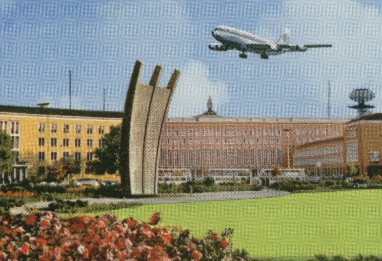 1960s A Pan Am 707 taking off from Berlin flies over a monument to the Berlin Airlift.